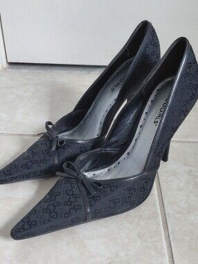 BCBGirls Black Monogram Pointed Toe Bow Heels
